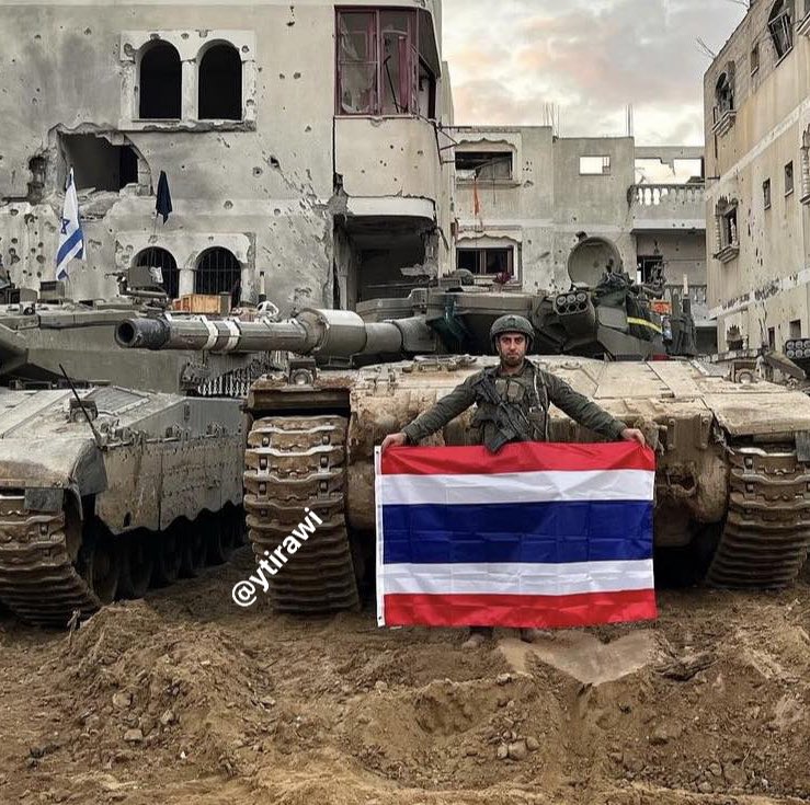 Thumbnail preview image for the video titled: Behind him a Palestinian torched home another Israeli soldier Segi Netzerr waiving the flag of Thailand