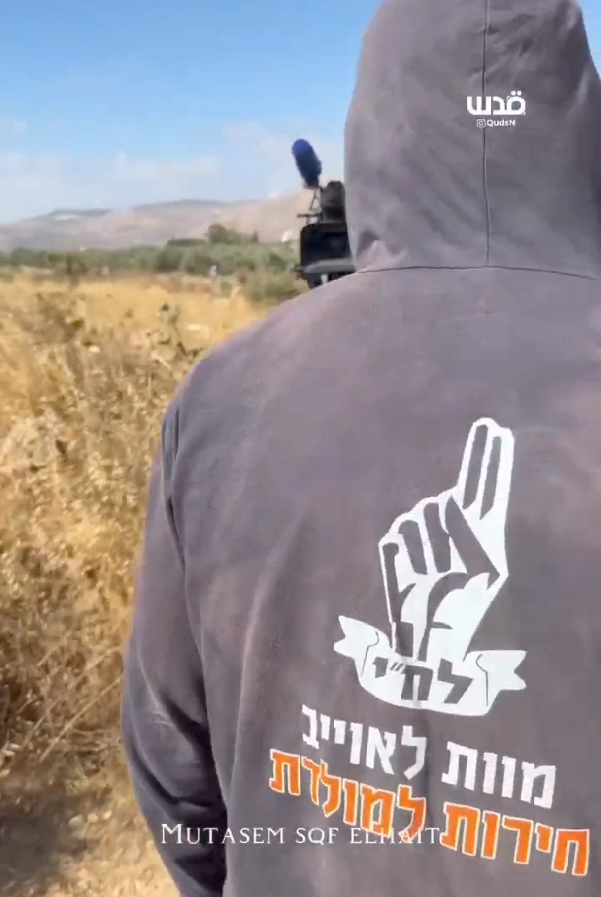 Thumbnail preview image for the video titled: This West Bank settler is wearing a hoodie of the 1940s Jewish terrorist organization Lehi (Stern Gang)