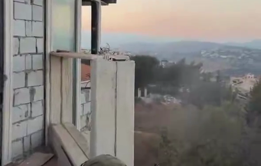 Thumbnail preview image for the video titled: Israeli soldier shooting at homes over the hills of southern Lebanon
