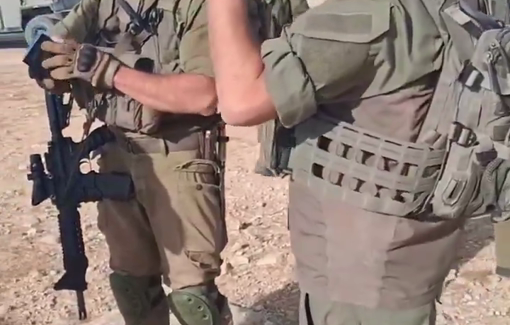 Thumbnail preview image for the video titled: Settler-soldier Betzalel Taljia prevents the work of U.S. activists in the West Bank, under the pretext that they are outsiders.