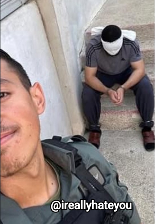 Thumbnail preview image for the video titled: Male IDF soldier taking selfies with a Palestinian hostage to post on social media