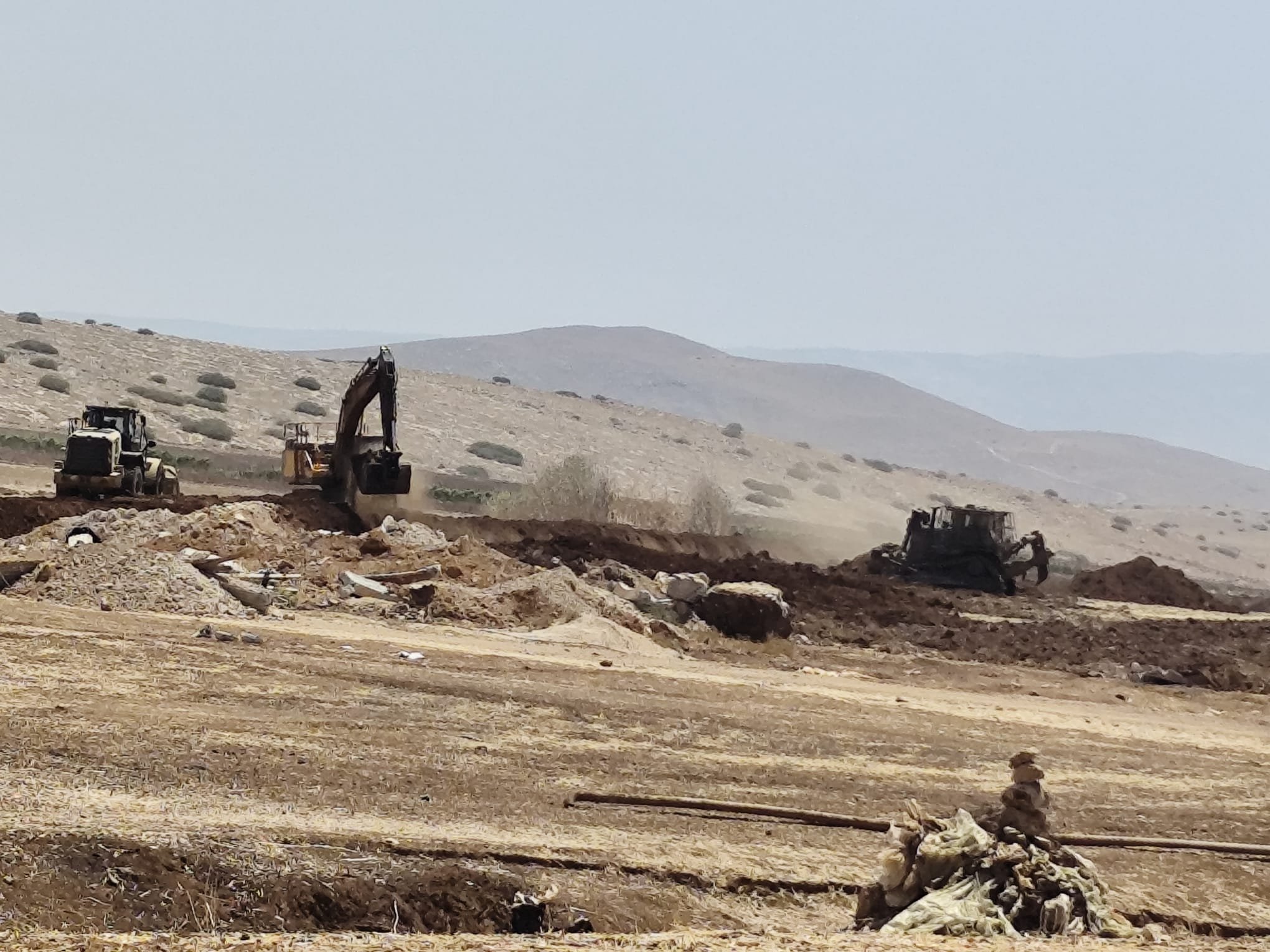 Thumbnail preview image for the video titled: The "Crimson Thread" barrier is built over Palestinian agricultural lands and greenhouses in the Jordan Valley