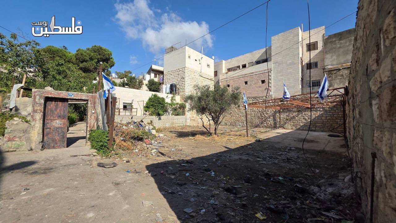 Thumbnail preview image for the video titled: Settlers raise Israeli flags on seized Palestinian land in Hebron’s Old City, backed by soldiers