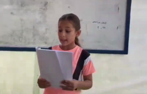 Thumbnail preview image for the video titled: In a tent classroom, a girl reads her text about the importance of electricity