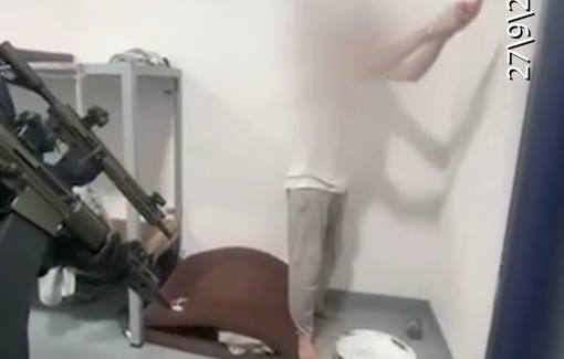Thumbnail preview image for the video titled: Palestinian forced to pain Israeli prison cell at gunpoint while handcuffed