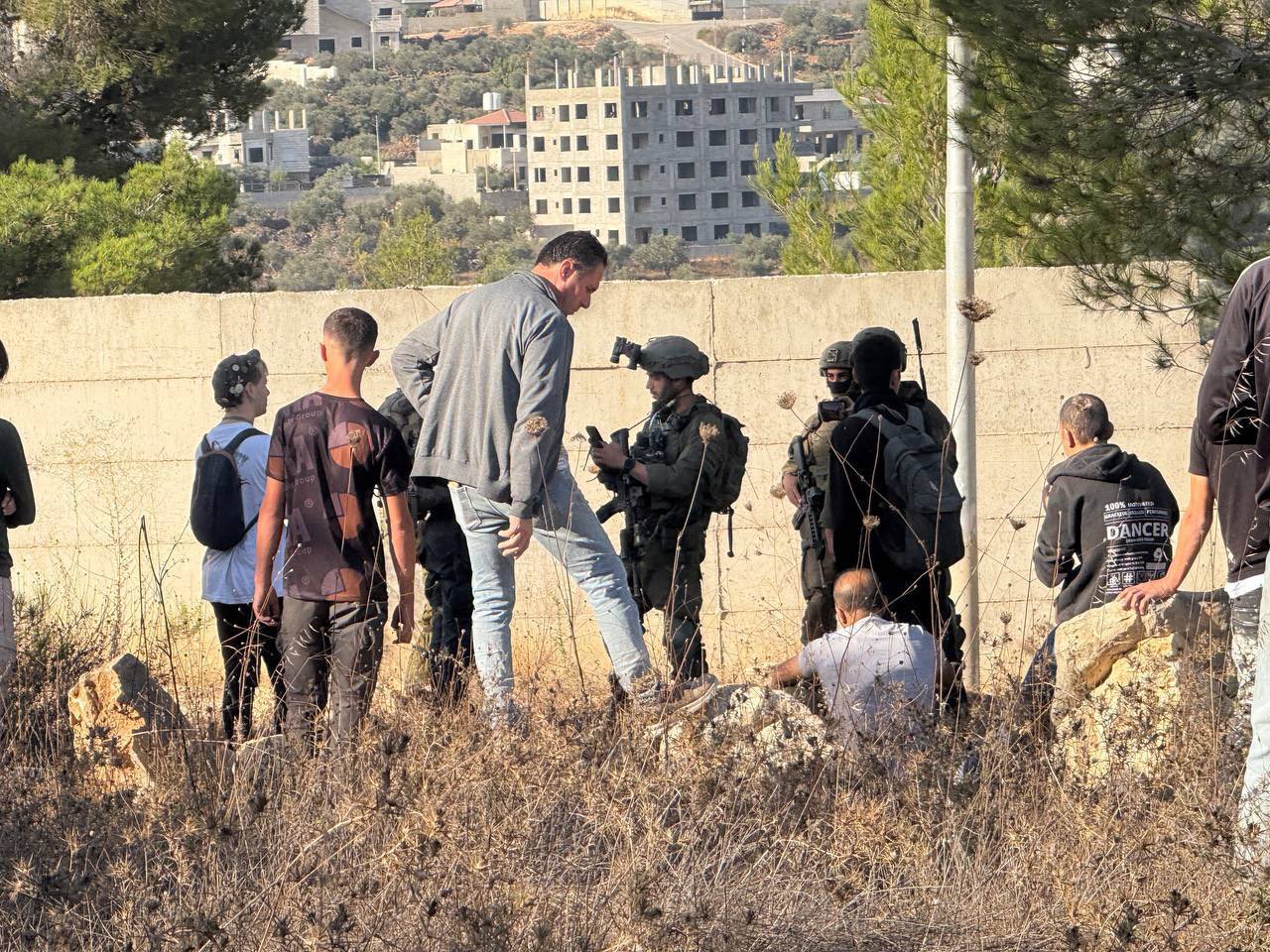 Thumbnail preview image for the video titled: Israeli forces prevent Palestinians from accessing their lands in Al-Dhahra area of Beita during the olive harvest