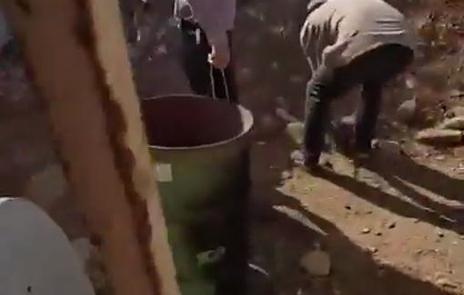 Thumbnail preview image for the video titled: Carmel settlers invading the courtyard of the Salem family in Umm al-Khair, fencing and settling under the army protection