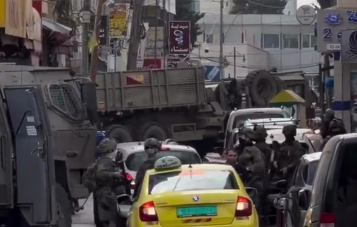 Thumbnail preview image for the video titled: Large numbers of Israeli troops storm the city of Ramallah, firing tear gas in direction of Journalists