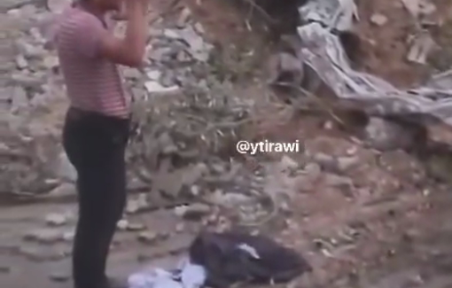 Thumbnail preview image for the video titled: Israeli soldier Kobi Margolis pointing his gun on women, elderly and children raising their hands in surrender